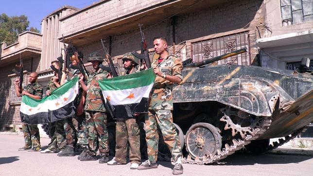 Los insurgentes sirios matan a 23 soldados en Rastan