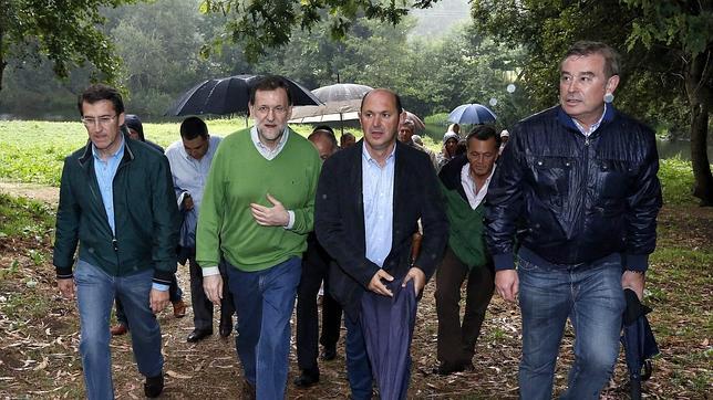 Las vacaciones de Rajoy, pasadas por agua