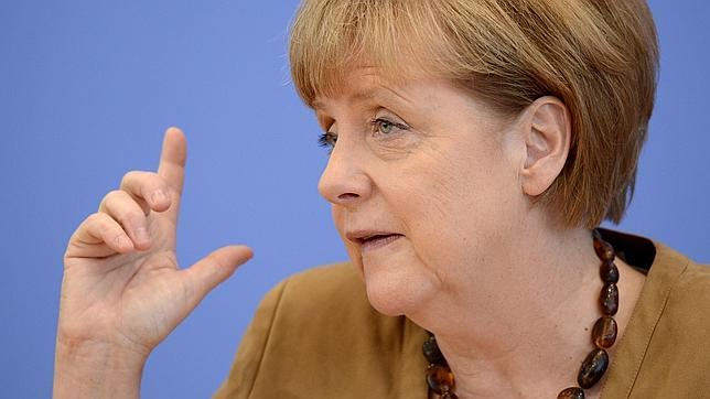 Merkel, escudo entre Rajoy y Mas: «Comparto la posición de España ante Cataluña»