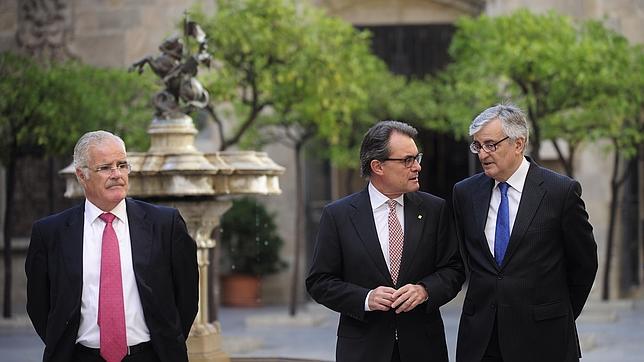 Artur Mas, el pasado mes de julio junto a Eduardo Torres Dulce y José María Romero de Tejada