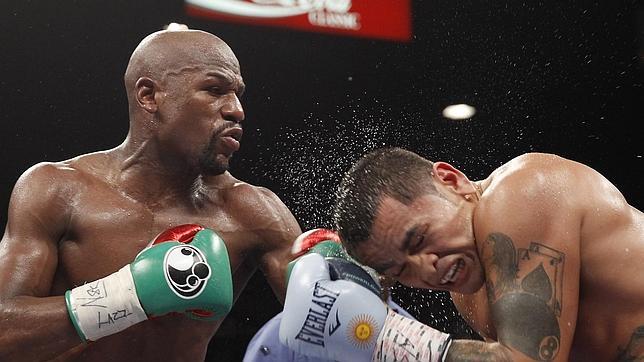 Mayweather llevará un protector dental de diamantes y oro