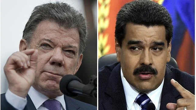 A la derecha, Nicolás Maduro. Al otro lado, el presidente colombiano Juan Manuel Santos