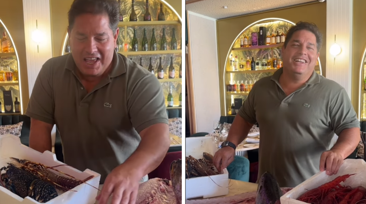 Javier de Baltazares con pescados y mariscos en su bar