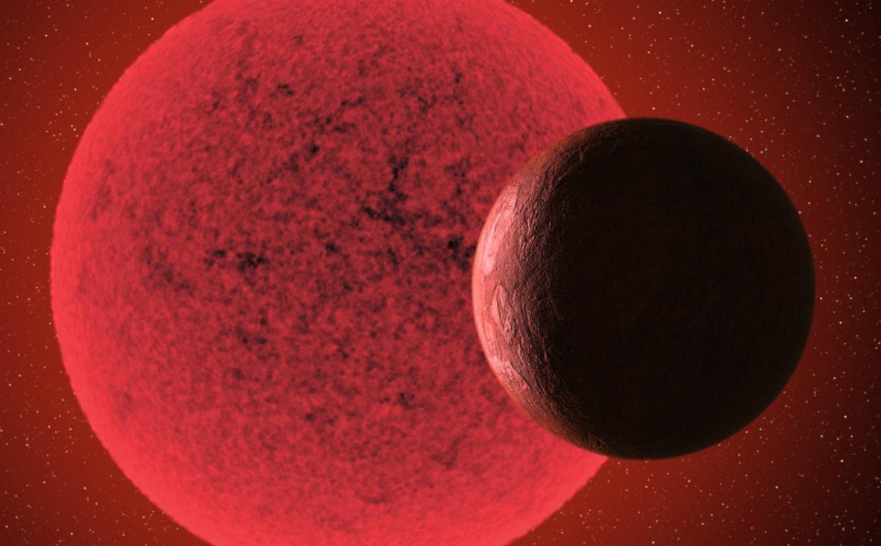 En la ilustración, una supertierra en órbita alrededor de una enana roja