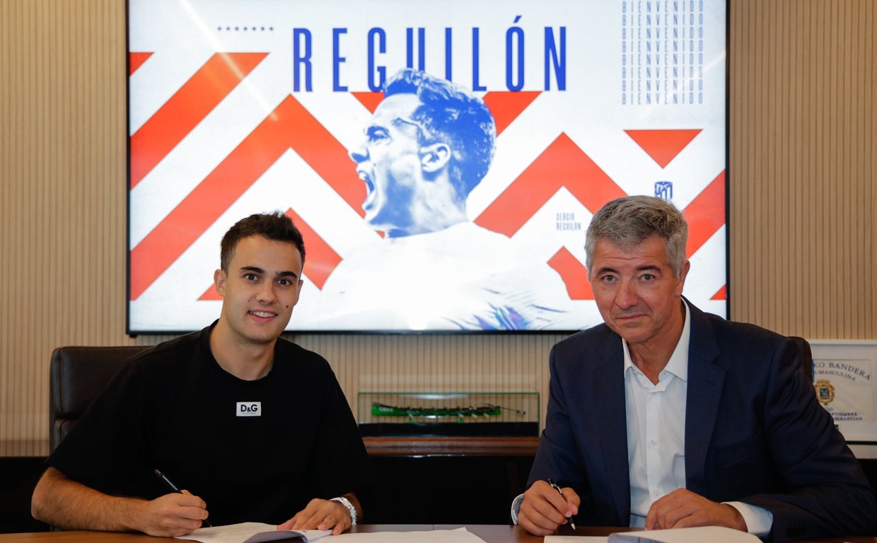 Reguilón y MIguel Ángel Gil Marín, en la firma.