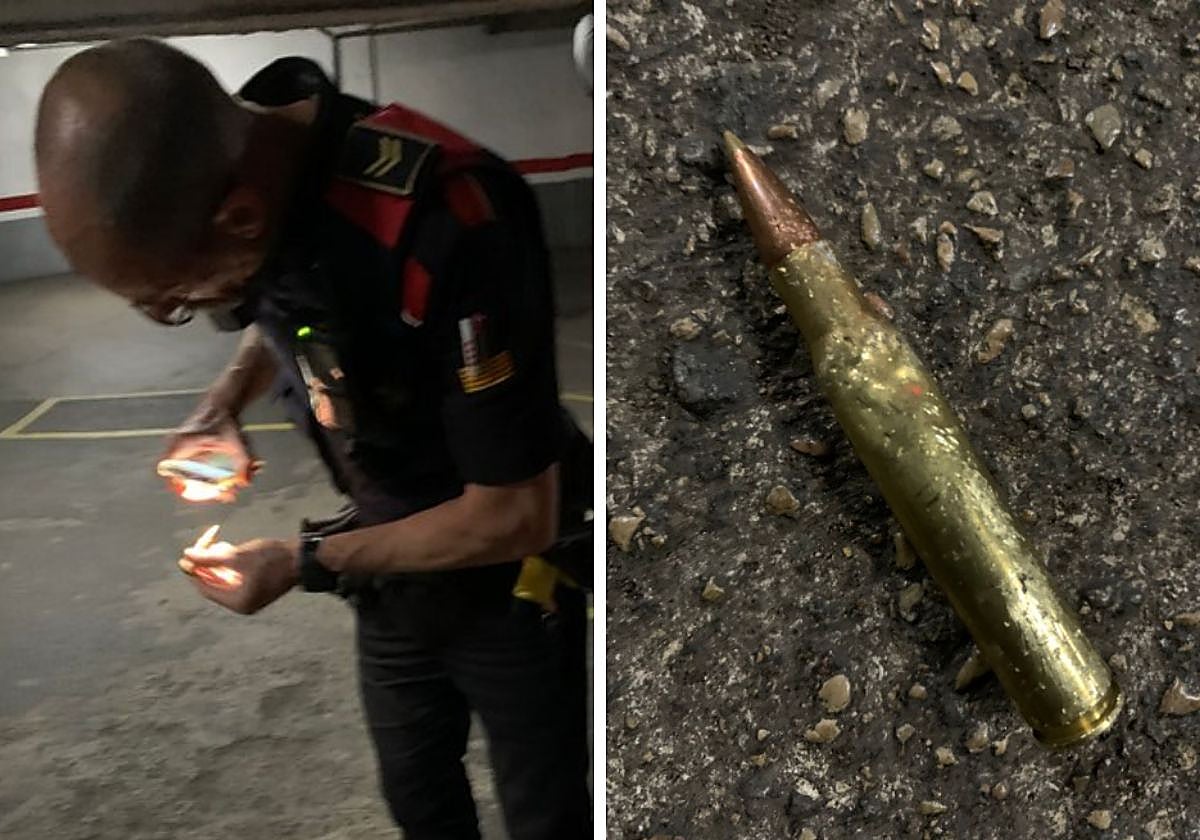 Un mosso analiza la bala encontrada en la plaza de párking del exárbitro Sergi Albert Giménez