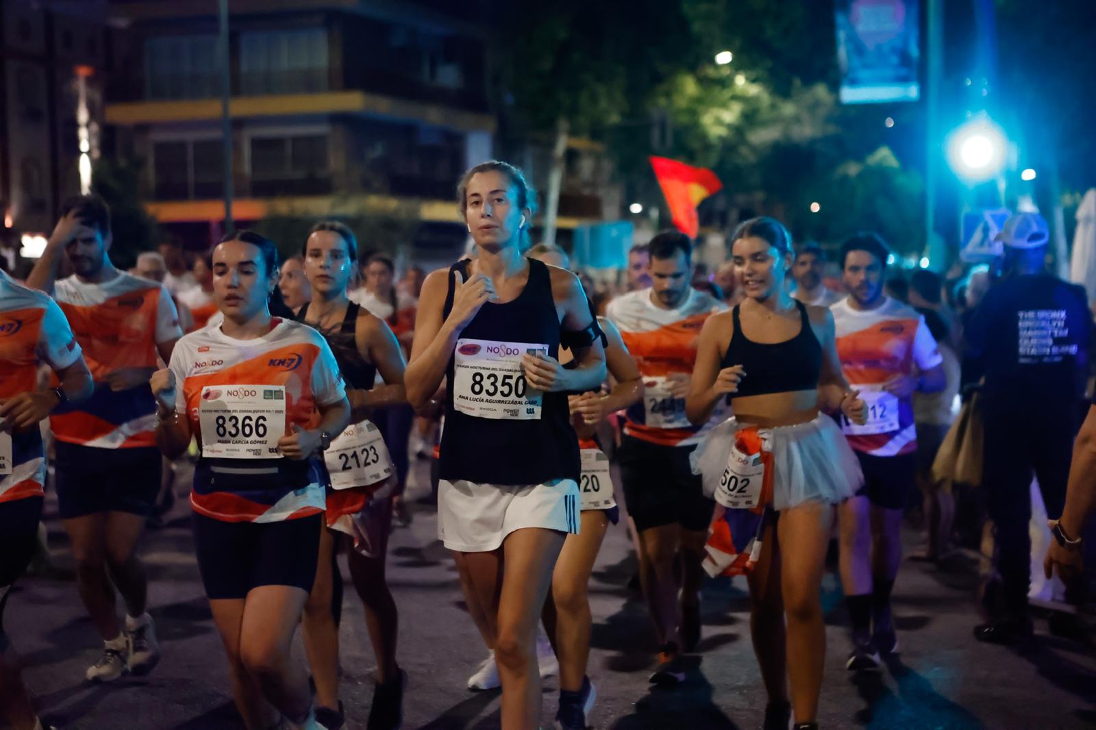 Búscate en la galería de imágenes de ABC de la Carrera Nocturna de Sevilla 2025