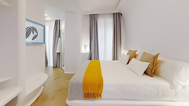 Imagen de una de las habitciones de hotel Suite Generis