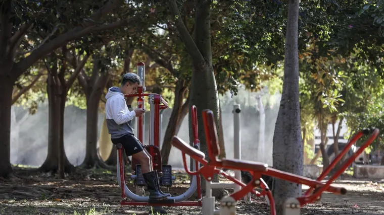 A young volunteer rests in a park in Picaña