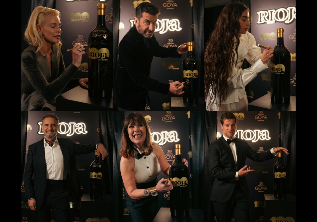 Algunos de los protagonistas de los Goya posando con una de las botellas de vino desaparecidas