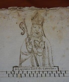 Imagen secundaria 2 - Arriba, el libro de difuntos. Abajo, izq., detalle de su interior. Dcha, un dibujo de San Cipriano, patrón de Cobeña, también en este voumen