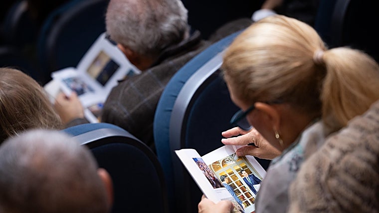 Presentation attendees explore the contents of Juanma Moreno's book