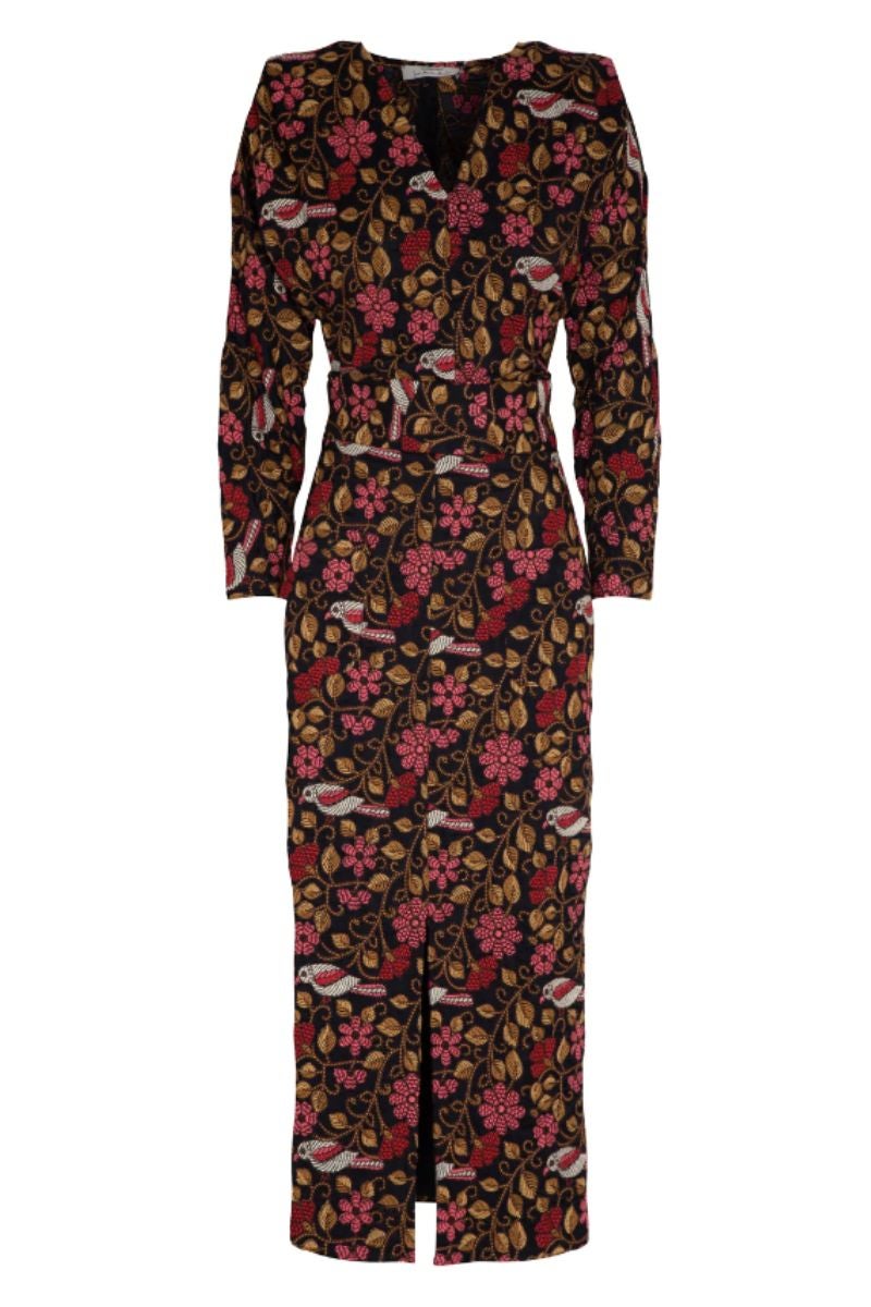 Conjunto de Inés Martín Alcalde compuesto por una falda tubo con abertura delantera y un cuerpo con el escote cruzado y mangas farol. Un diseño con estampado de flores que se adapta a la silueta y cuyo aire vintage lo convierten en una pieza atemporal, perfecta para todo tipo de eventos. Precio: 530 €.