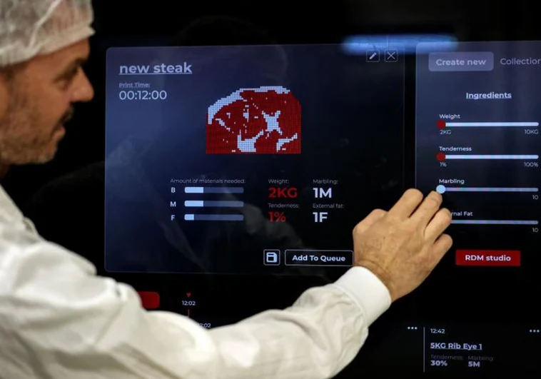 A Redefine Meat employee, demonstrating the cultured meat production process