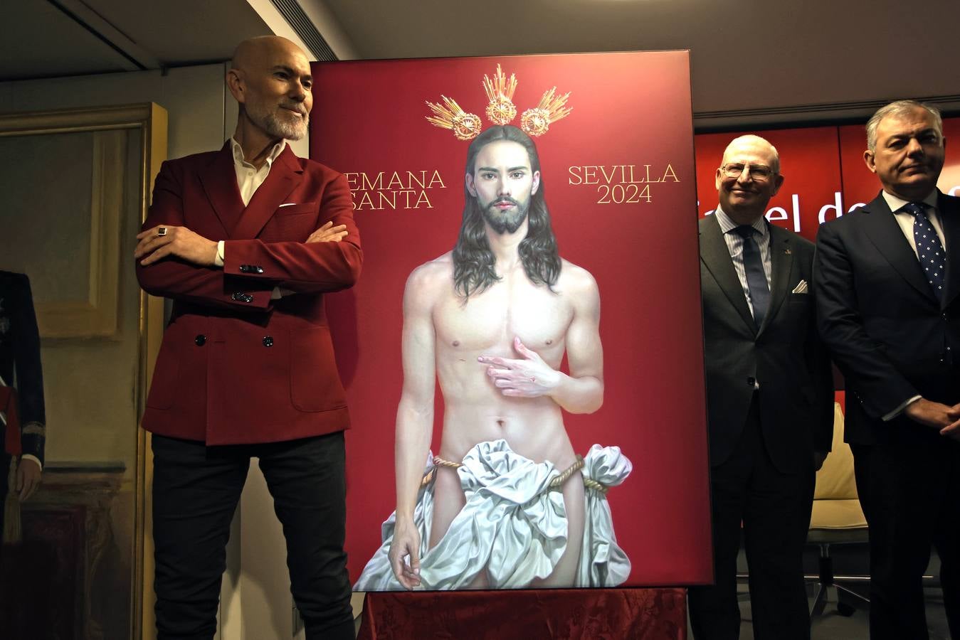 El cartel muestra a Jesús resucitado con un fondo rojo fiel al estilo de Salustiano García