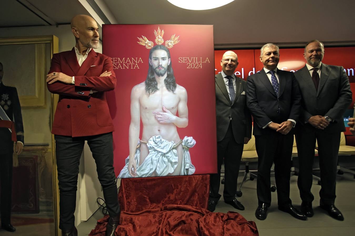 El cartel muestra a Jesús resucitado con un fondo rojo fiel al estilo de Salustiano García