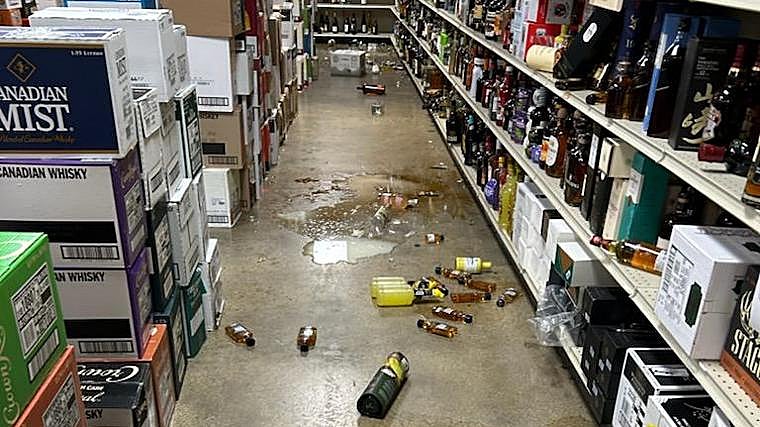 A raccoon enters a closed liquor store, smashes dozens of bottles, and gets drunk on whiskey