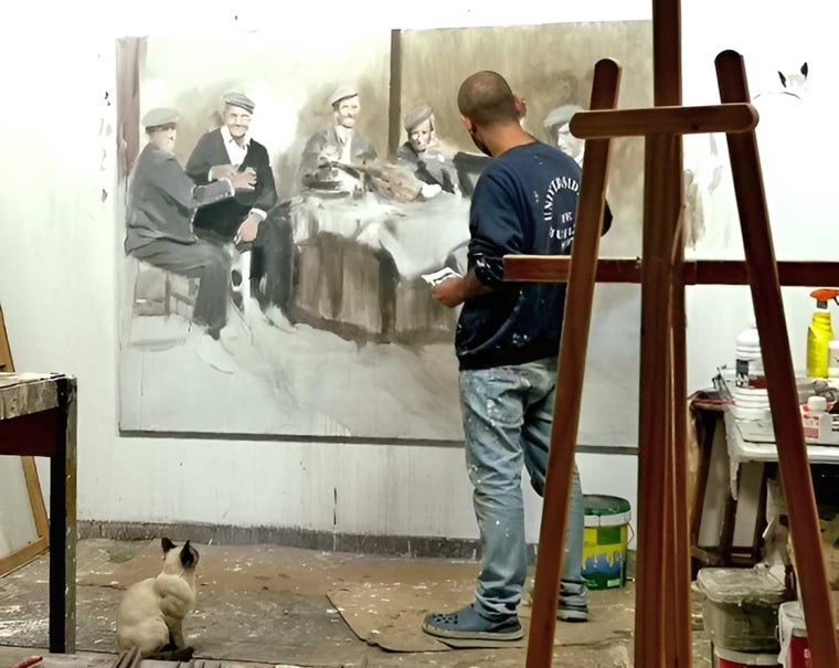 El pintor en su estudio, observado por su gata