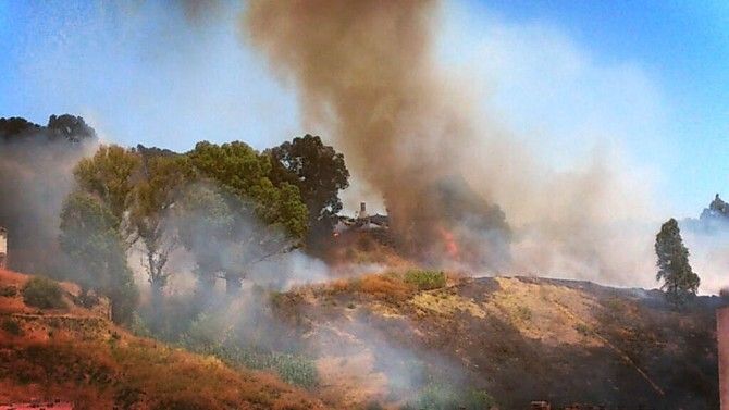 Un nuevo incendio castiga por segundo día consecutivo las laderas del Conquero