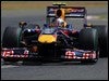 Vettel arrebata la pole a Button en su casa