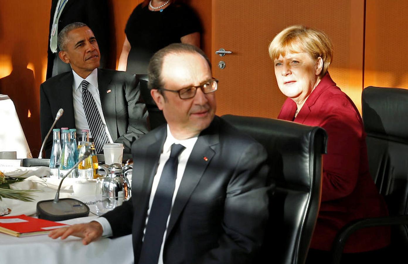 Obama, Merkel y Hollande, durante la Cumbre celebrada en Berlín