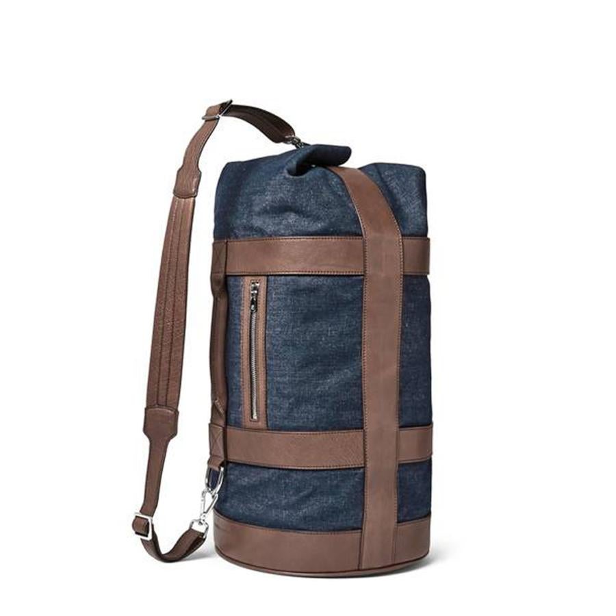 Bolsa de viaje en piel marrón y tela vaquera (2.490€)