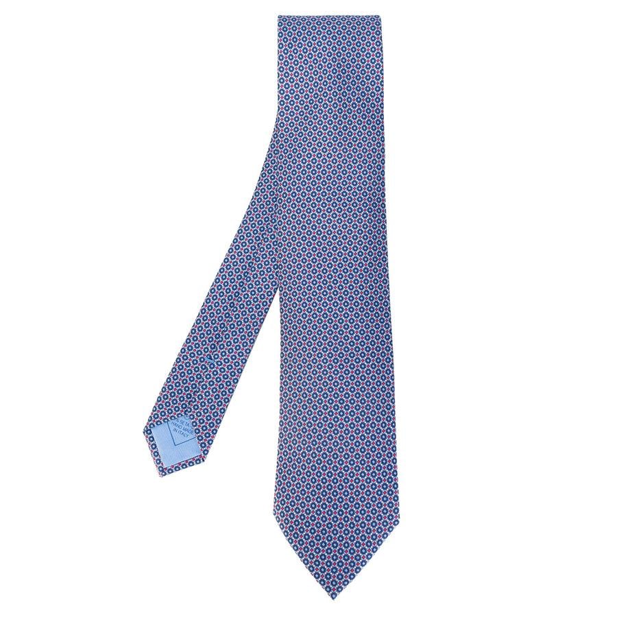 Corbata en seda azul estampada (195€).