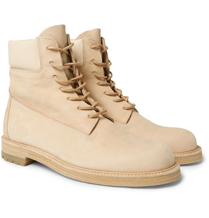 Botas de Hender Scheme. Robustas pero refinadas, estas botas con cordones 'MIP-14' se han fabricado en Japón con cuero liso y acabado con collares acolchados de cuero texturado para un acabado de lujo (Precio: 1125euros).