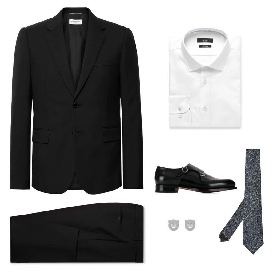 Look de Nochevieja con traje y cuadrado. Para los amantes del estilo clásico, nada como un traje de color negro como este de Saint Laurent (precio: 2.250 euros) y una camisa blanca de Hugo Boss (precio: 115 euros), al cual le puedes añadir una elegante corbata de Cerruti 1881 (precio: 279 euros), unos gemelos de Salvatore Ferragamo (precio: 180 euros) y unos zapatos negros con hebilla de Santoni (precio: 840 euros).
