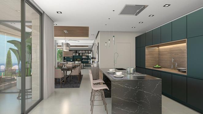 Una villa de lujo frente al mar en Jávea. De diseño elegante y con electrodomésticos de alta gama ocultos, la cocina cuenta con gabinetes en tono verde oscuro y una gran isla central de mármol con barra de desayuno y fregadero.