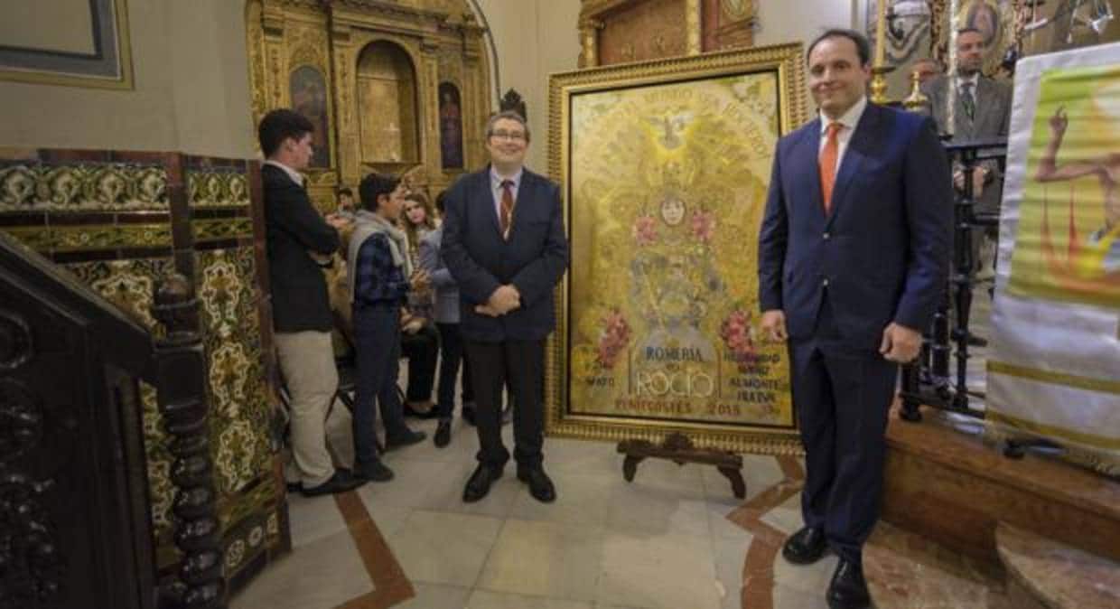 Juan Ignacio Reales, presidente de la Matriz y Raúl Berzosa, autor de la obra presentan el cartel de la Romería del Rocío 2018