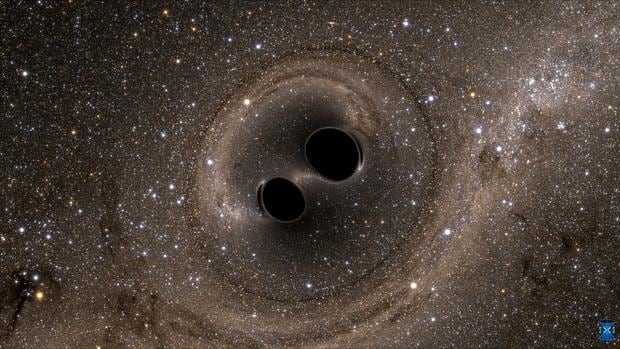 Un par de agujeros negros en colisión