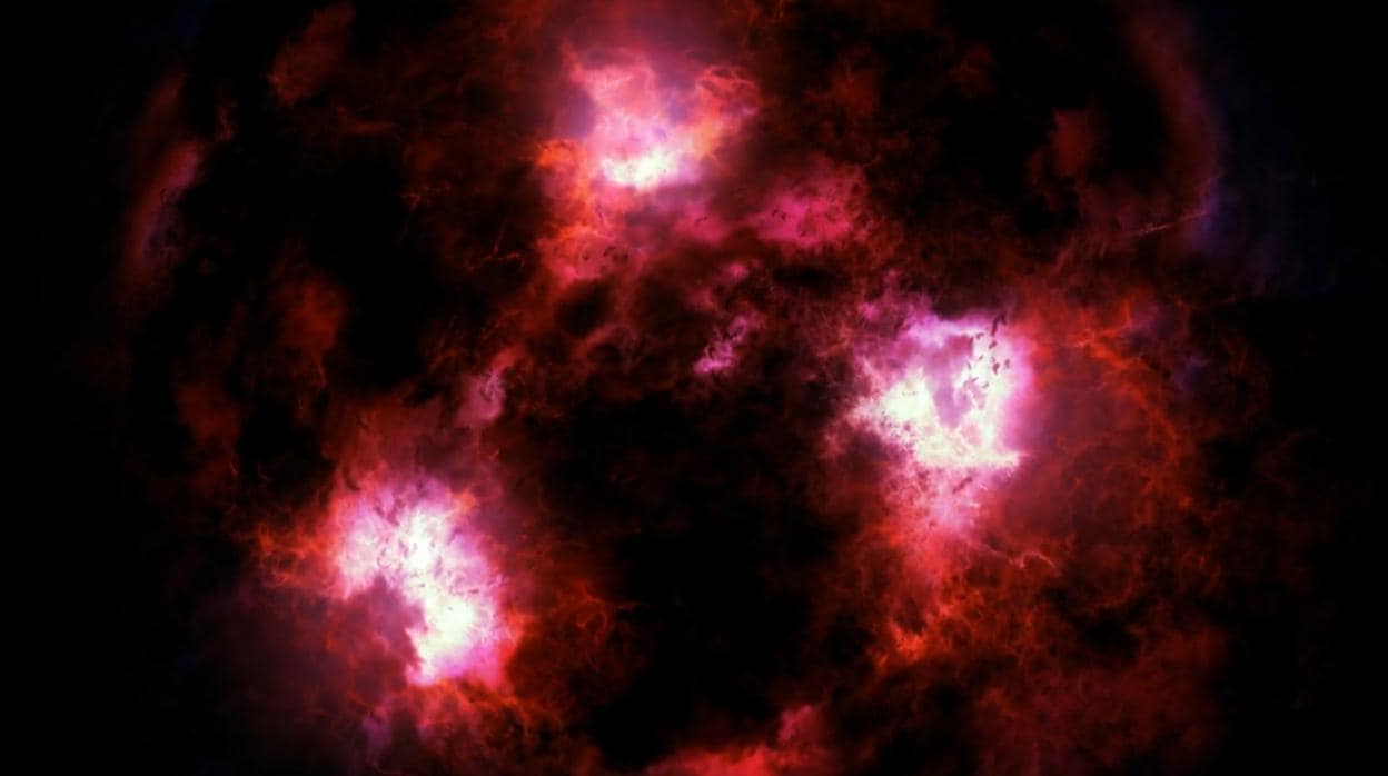 A través de una espesa nube de polvo y gas, los astrónomos han conseguido obtener imágenes de una monstruosa galaxia en los confines del Universo