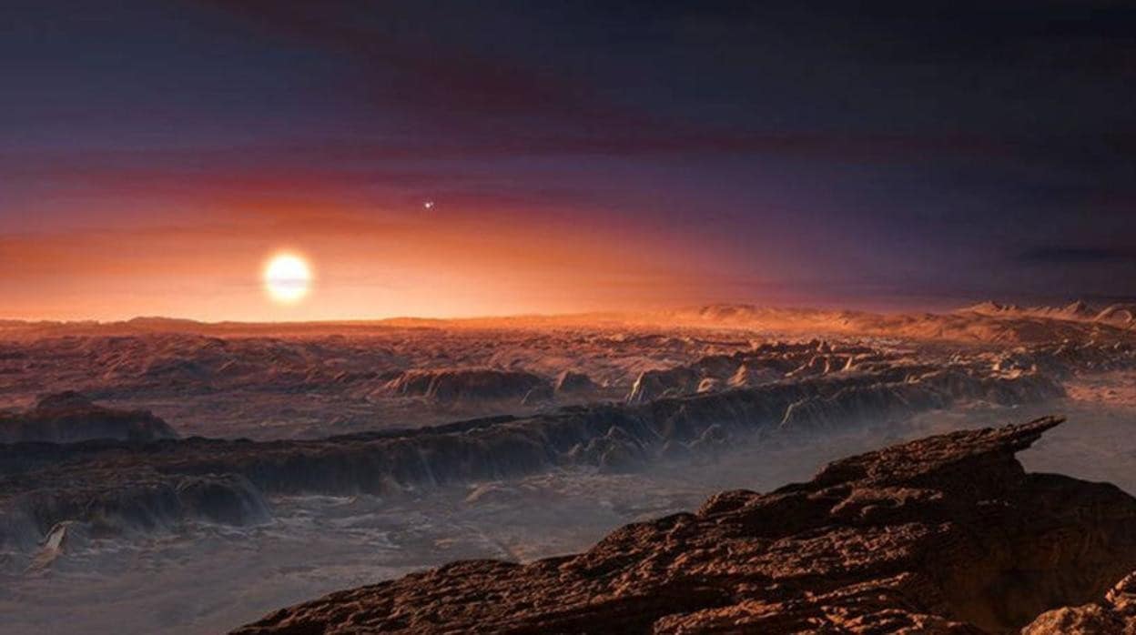 Reconstrucción de Próxima b, el exoplaneta hallado en 2016 alrededor de Próxima Centauri, que aparece junto al horizonte. Un poco más arriba, a la derecha, Alpha Centauri A, donde se podría haber descubierto un nuevo planeta potencialmente habitable