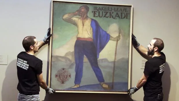 Personal de la pinacoteca coloca el cuadro "Irakurri-Léase 'Euskadi'"