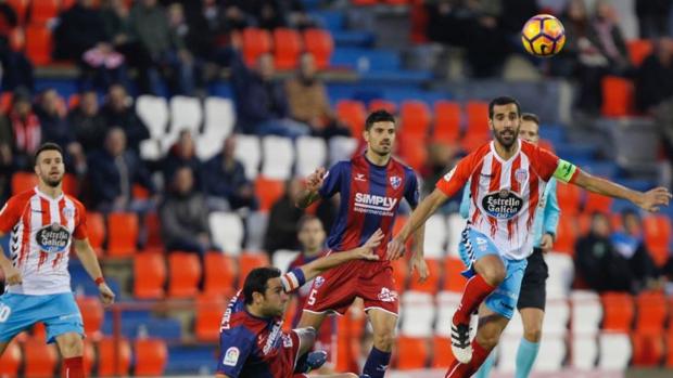 Lugo y Huesca empatan y llegan a Navidad en zona de promoción