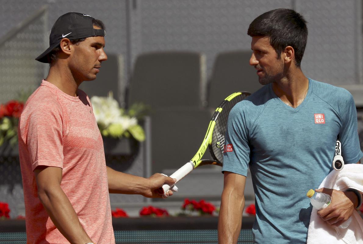 Rafa Nadal y Novak Djokovic durante uno de los entrenamientos de esta semana en la pista central Manolo Santana
