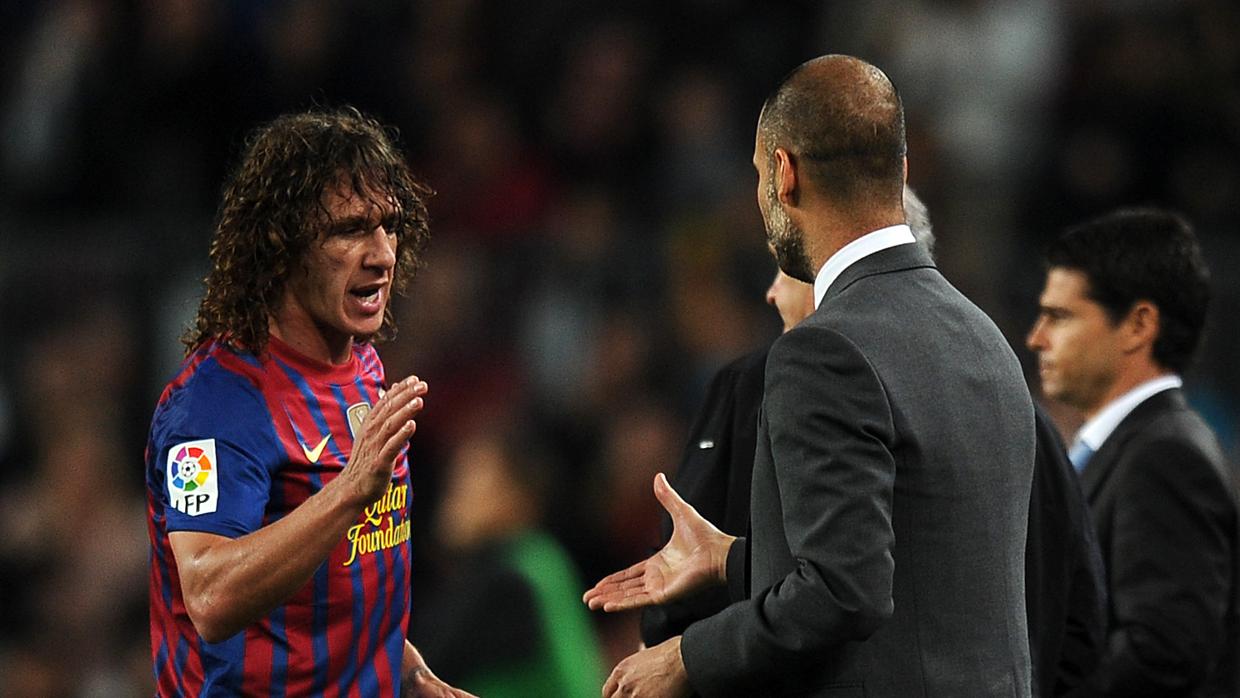 Carles Puyol y Pep Guardiola durante un partido