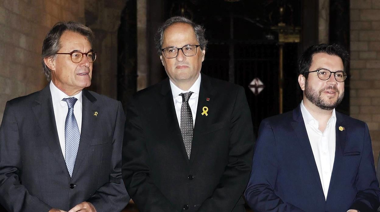 Los expresidentes de la Generalitat, Artur Mas y Quim Torra, y el actual presidente en funciones, Pere Aragonés