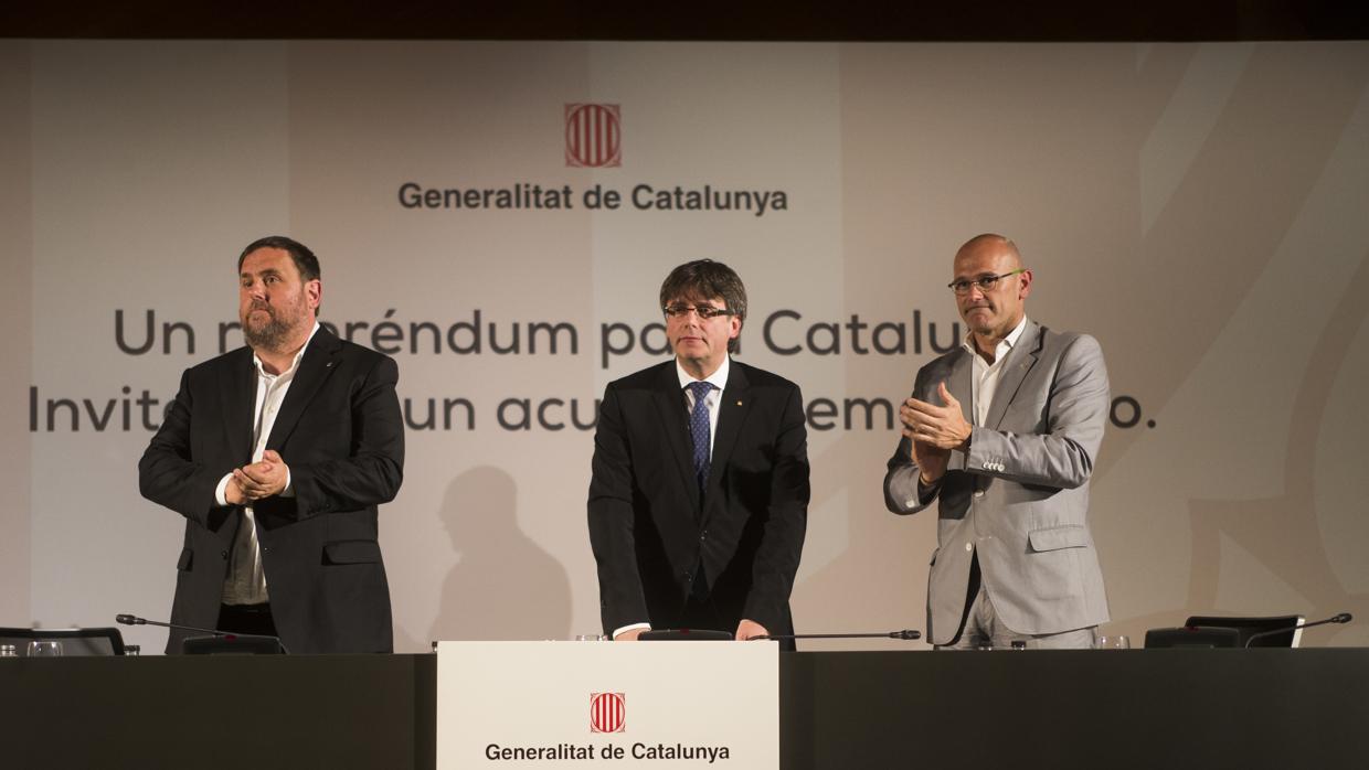 Junqueras, Puigdemont y Romeva, durante la presentación del referéndum en Madrid