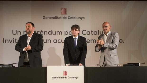 Junqueras, Puigdemont y Romeva, durante la presentación del referéndum en Madrid
