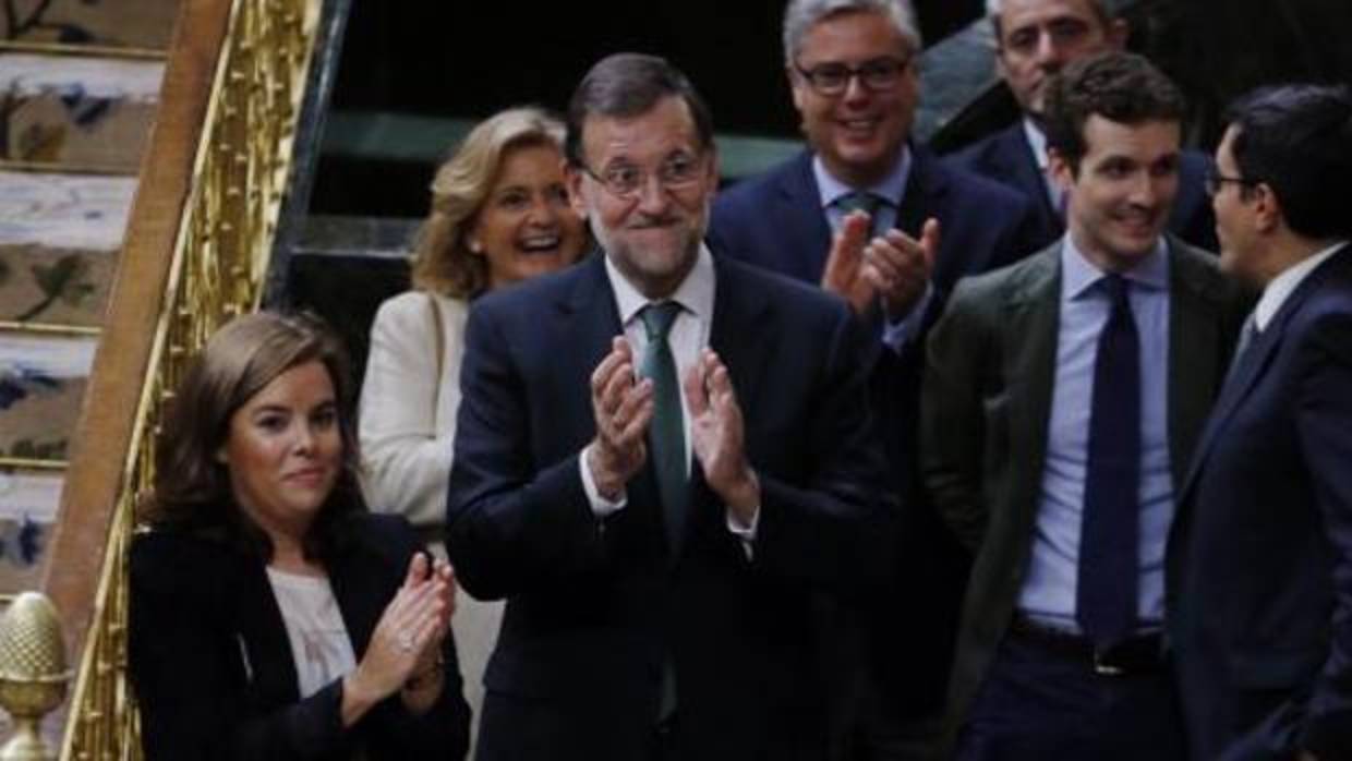 Santamaría, Rajoy y Casado, en el Congreso, en 2015