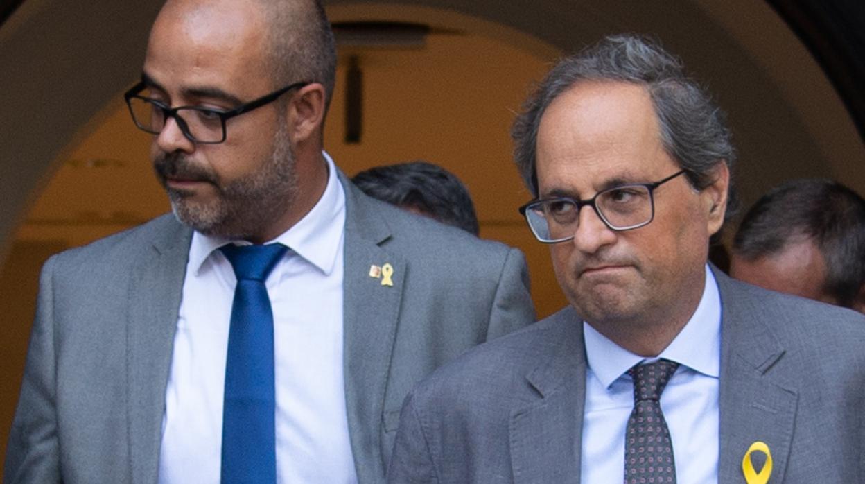 El consejero de Interior, Miquel Buch, y el presidente catalán, Quim Torra