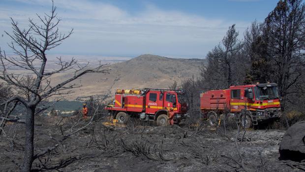 Controlado el incendio de La Granja, aunque su total extinción tardará «15 ó 20 días»