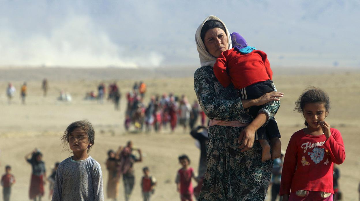 Desplazados yazidíes huyen de la violencia de Daesh en 2014