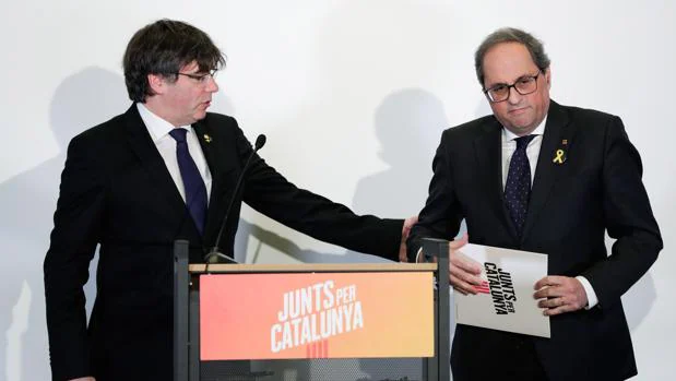 El expresidente de la Generalitat de Cataluña Carles Puigdemont y el actual responsable del Ejecutivo catalán, Quim Torra