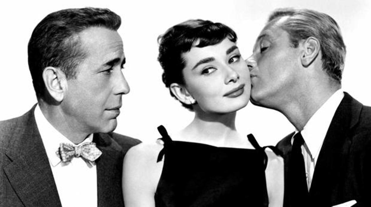 Humphrey Bogart, Audrey Hepburn y William Holden en la imagen promocional de «Sabrina»