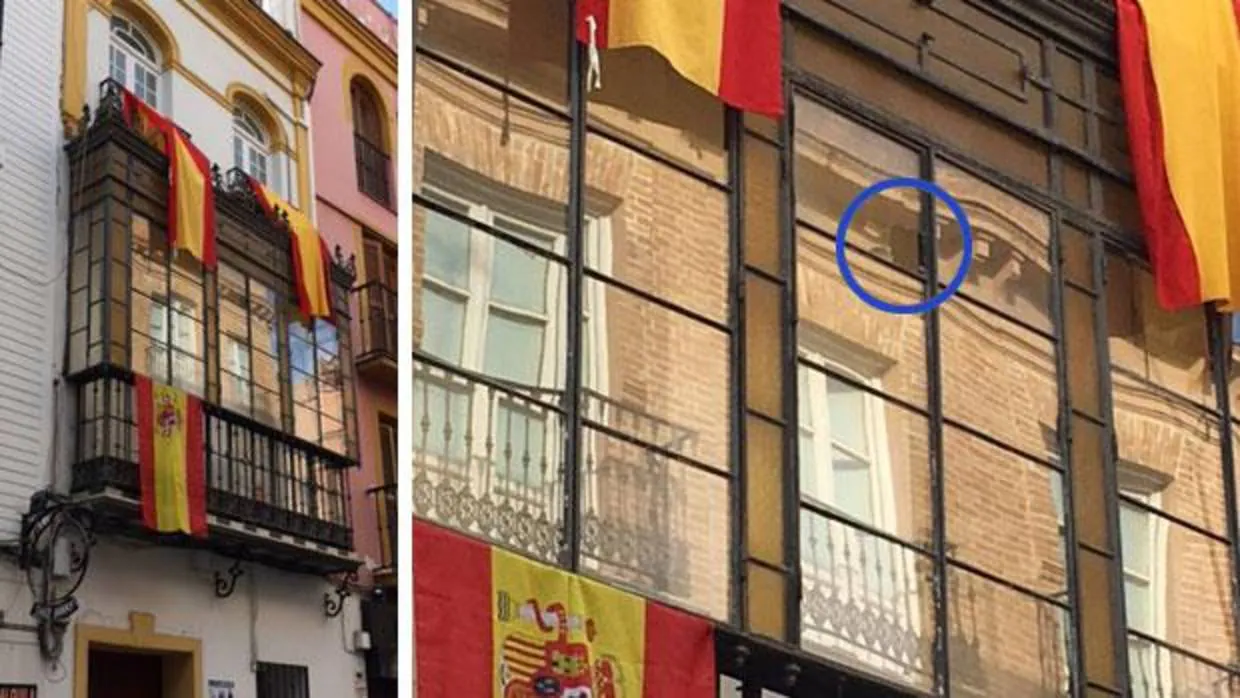 Los ventanales adornados con banderas de España que recibieron un botellazo la pasada madrugada