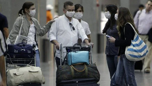 Una imagen de archivo en el aeropuerto internacional de Río de Janeiro (Brasil), donde en 2009 ya hubo un brote mortal de gripe Aon a once el balance de fallecidos poresta enfermedad en ese pa